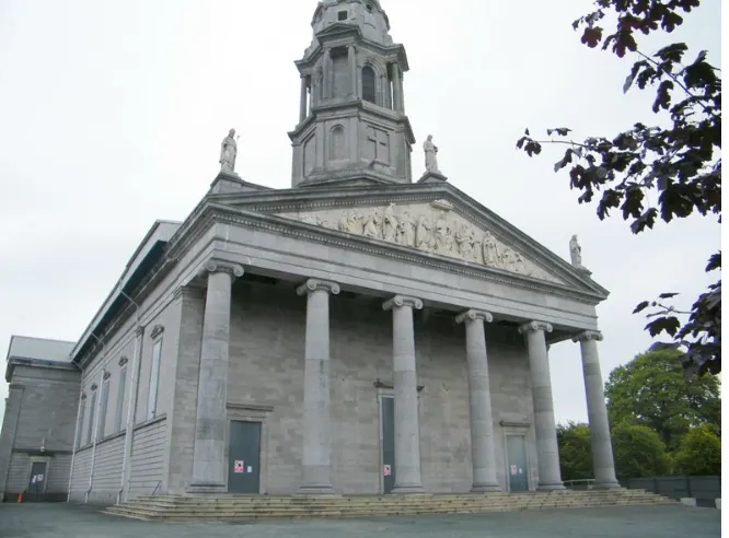 Neoclassical church with columned portico and bell tower in Ireland