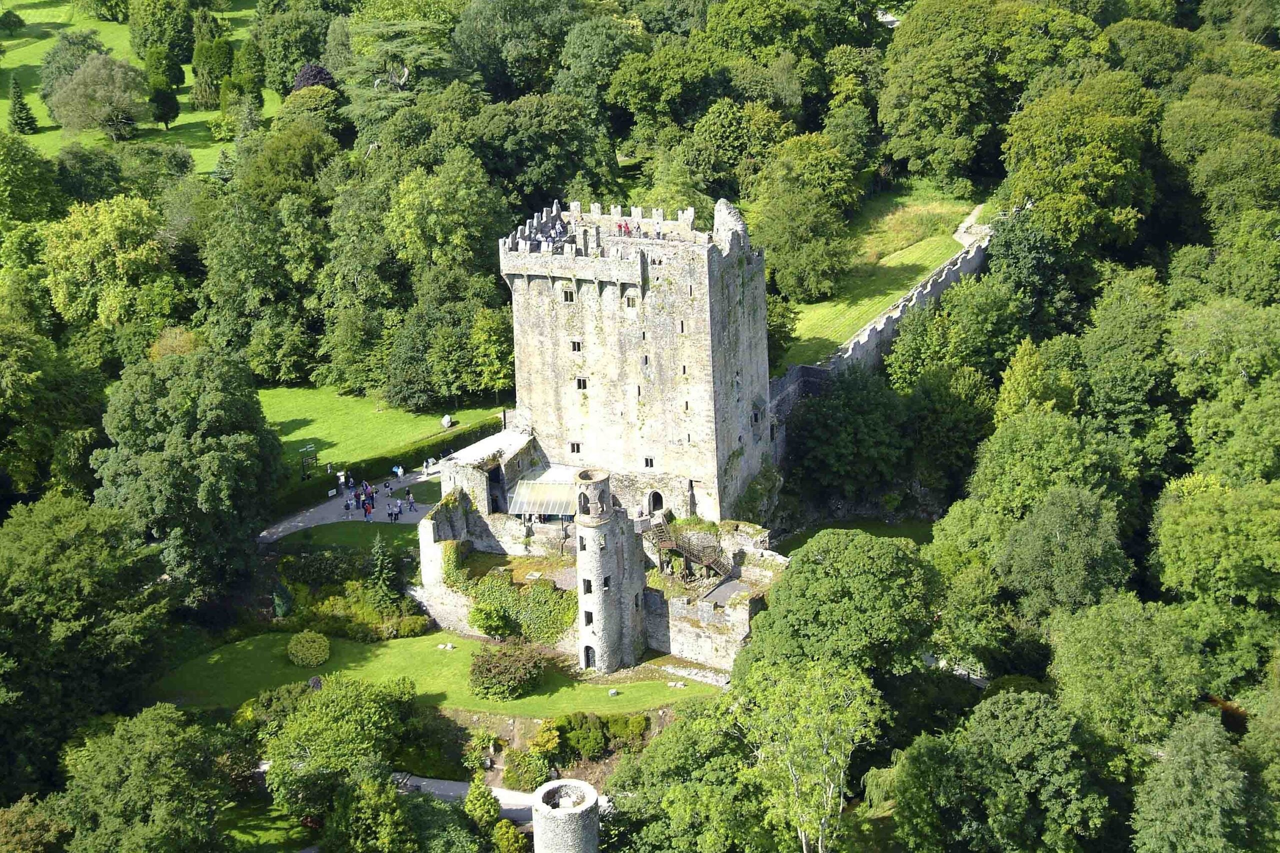 Blarney Castle in County Cork, Ireland, where visitors climb to kiss the famous Blarney Stone