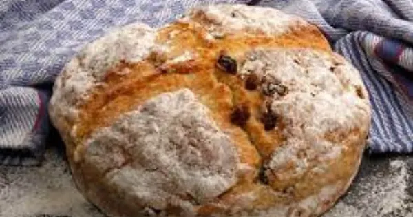 Freshly baked Irish soda bread with raisins on linen cloth