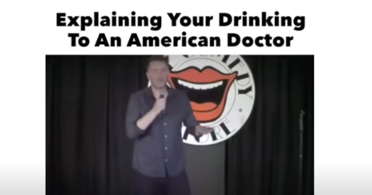 Irish comedian Jarlath Regan performing his Irish wedding drinking stand-up bit on stage at Vicar Street, Dublin