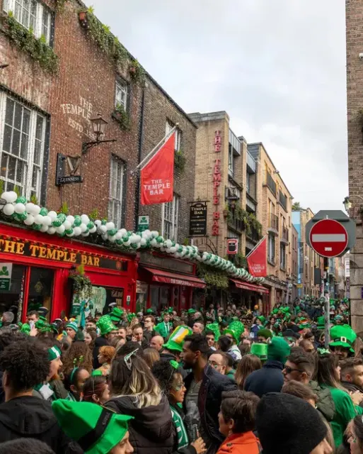 St. Patrick's Day People gathered on Temple Bar to celebrate St. Patrick's day - Shutterstock