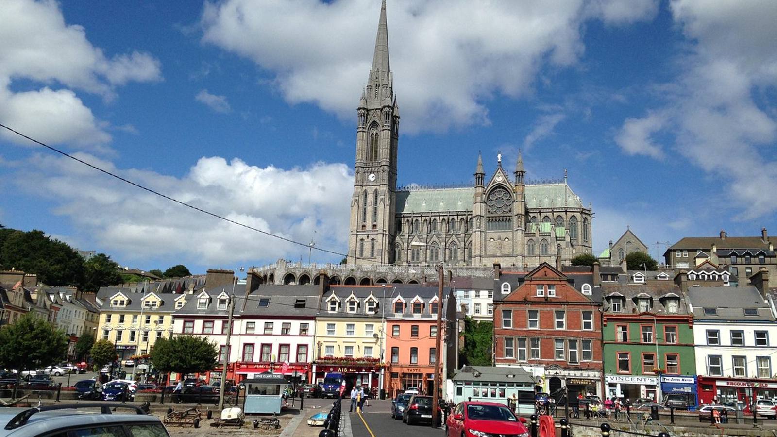 Cobh harbour with St Colman's Cathedral rising above the colourful waterfront, County Cork, Ireland