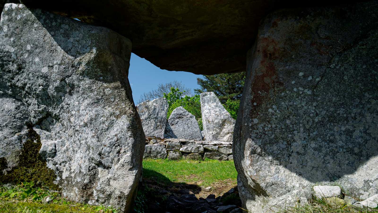 Ancient Irish megalithic stone tomb chamber with standing stones Ireland