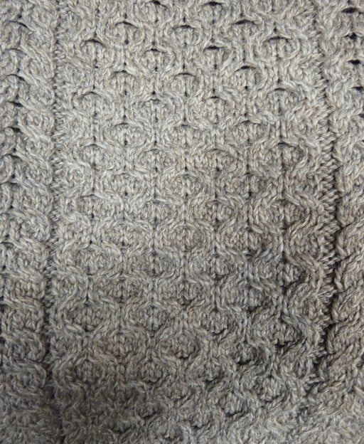 Close-up of honeycomb stitch pattern on a traditional Irish Aran sweater
