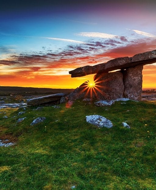 Poulnabrone Dolmen in the limestone landscape of the Burren at sunset, County Clare