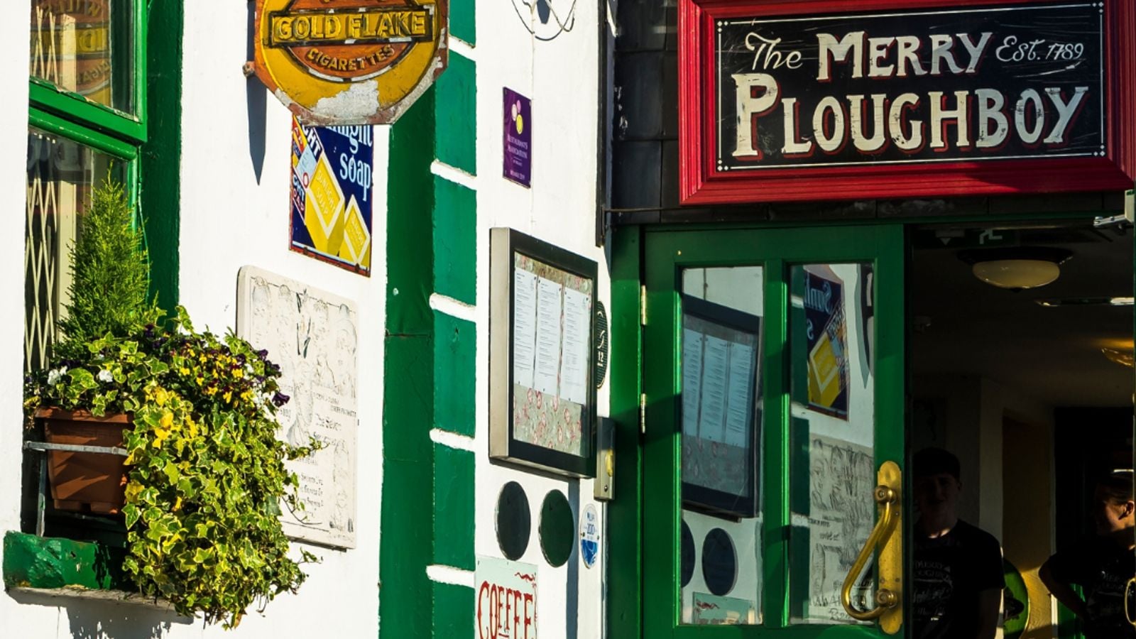 Traditional Irish music session inside a Dublin pub with musicians playing trad instruments