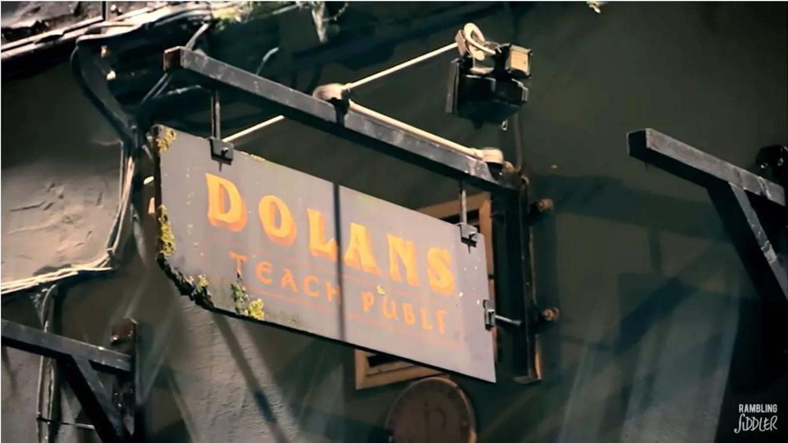 Musicians playing traditional Irish music at a trad session in a pub, with fiddle and accordion