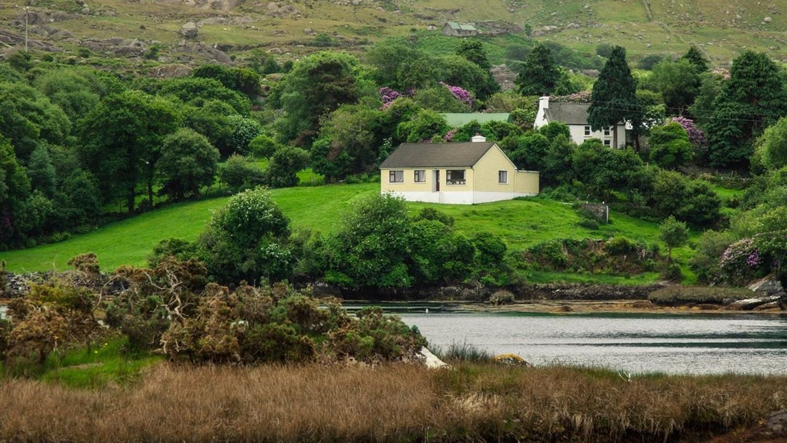 Rolling green fields and coastline near Doolin, County Clare, Ireland