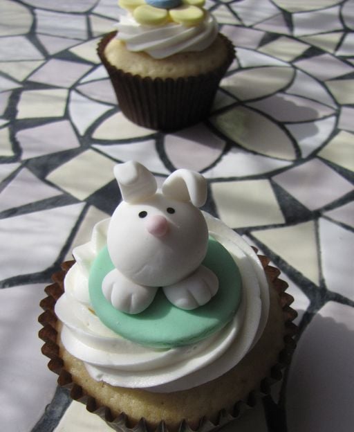 Easter bunny cupcake with white fondant bunny figurine and buttercream frosting