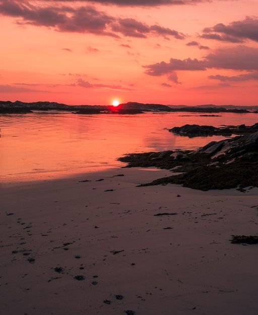 Golden evening light over the wild Atlantic coastline near Clifden, County Galway, Ireland