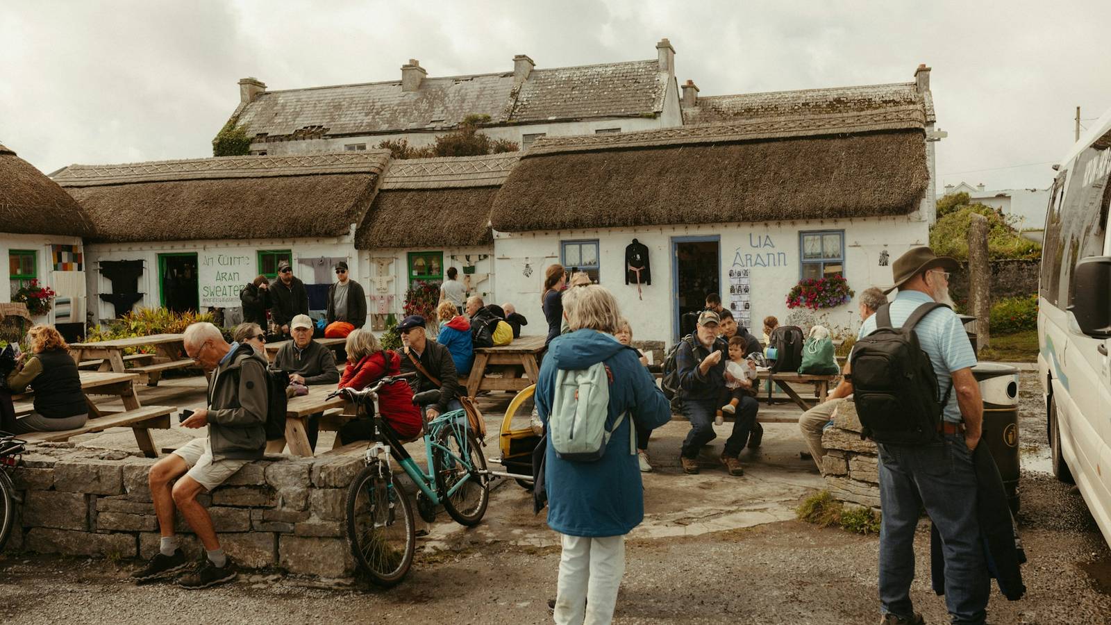 Traditional white thatched cottages in Ireland, a scene of cultural heritage and community
