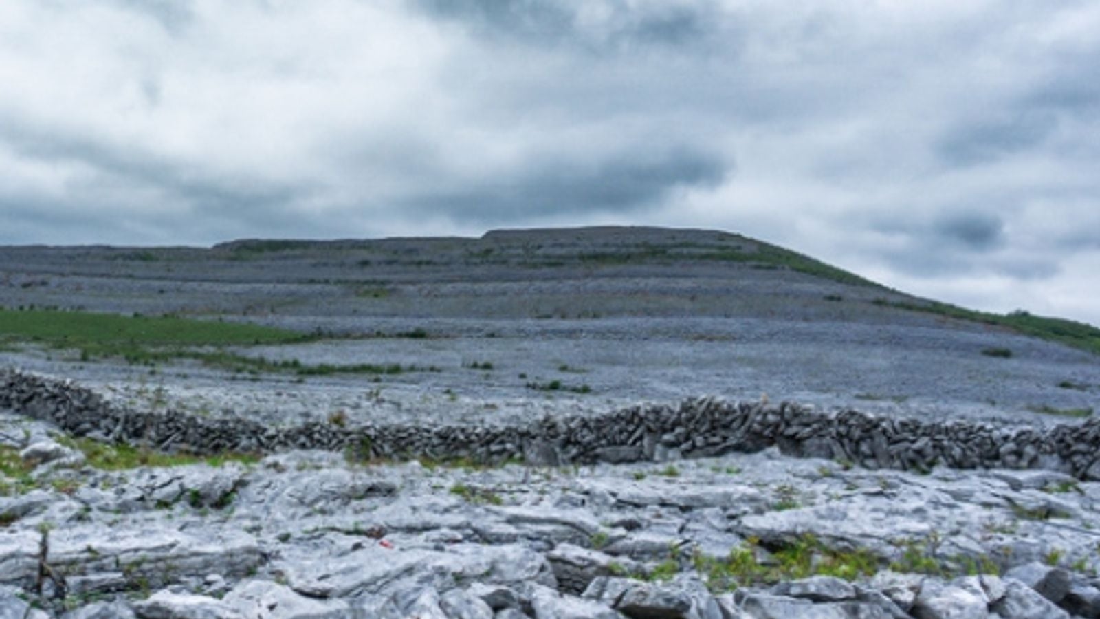 The Burren limestone pavement in County Clare Ireland stretching across bare grey karst rock