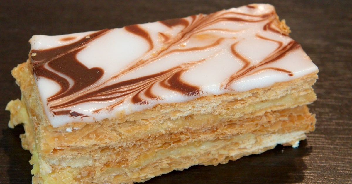 Layers of golden puff pastry filled with cream and topped with coffee fondant icing, classic Irish bakery style