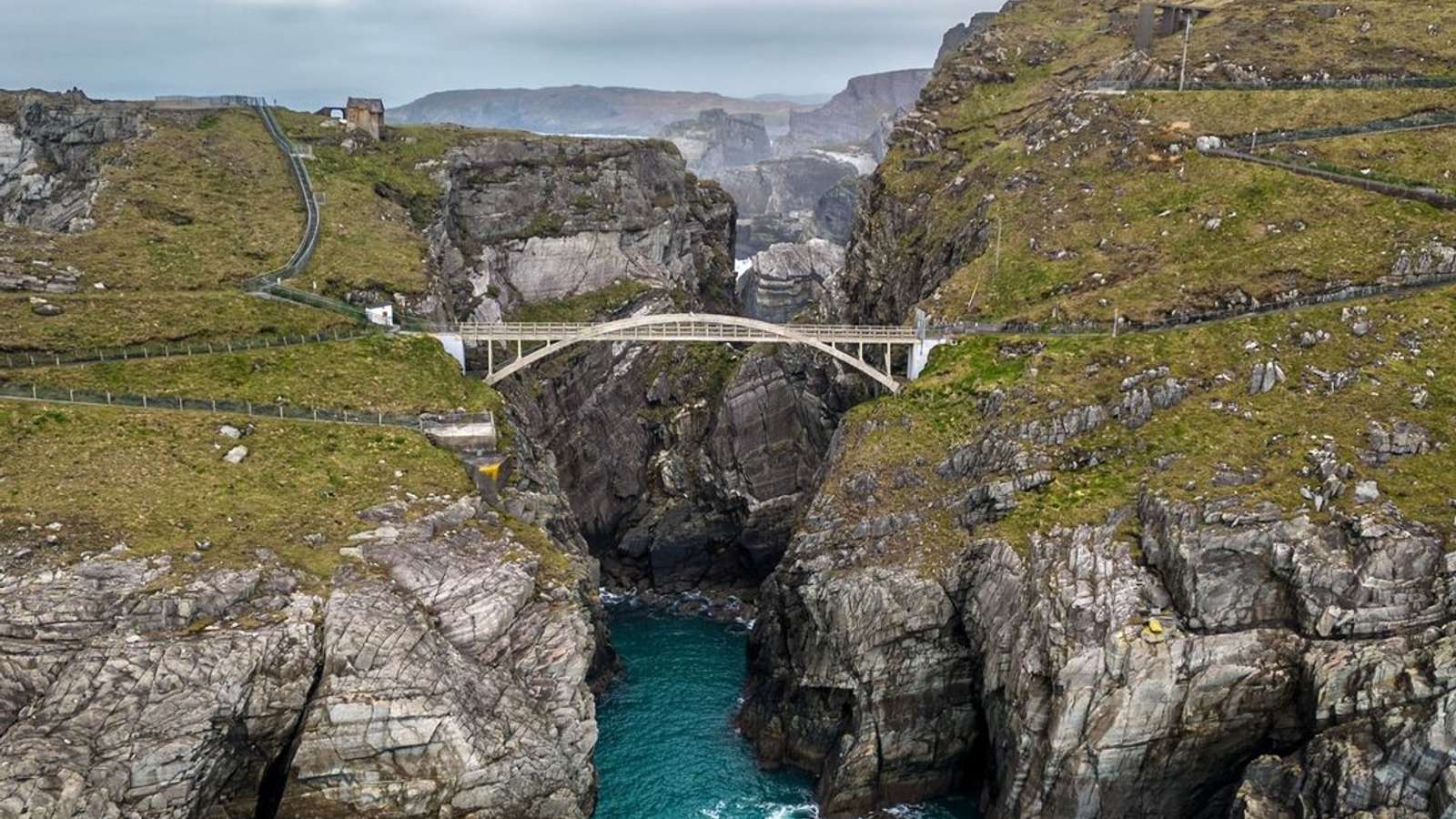 Dramatic cliffs and turquoise Atlantic waters at Mizen Head, West Cork, Ireland