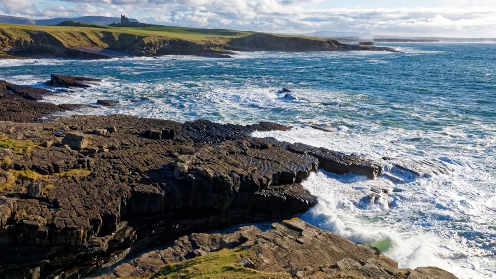 Waves crashing on rocky Atlantic coastline Ireland