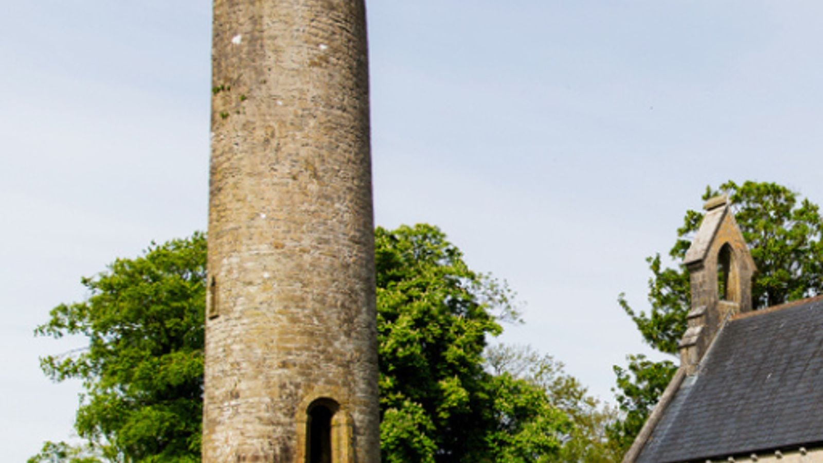 Timahoe Round Tower, a well-preserved 12th-century Irish round tower in County Laois, with its characteristic elevated doorway and conical stone cap