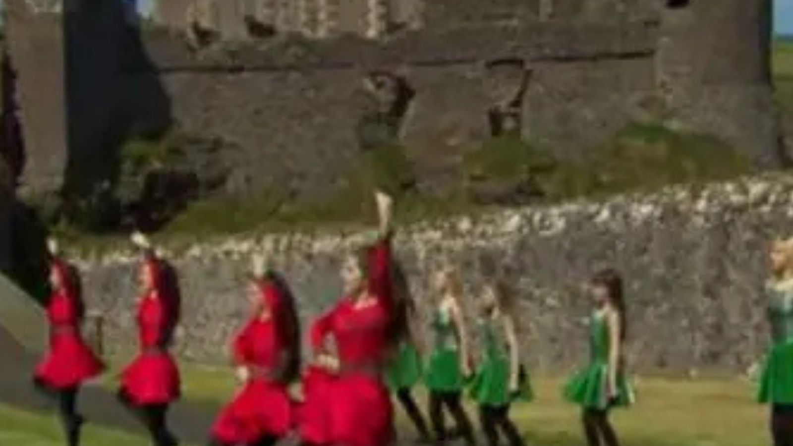People dancing a traditional Irish set at Dunluce Castle, County Antrim