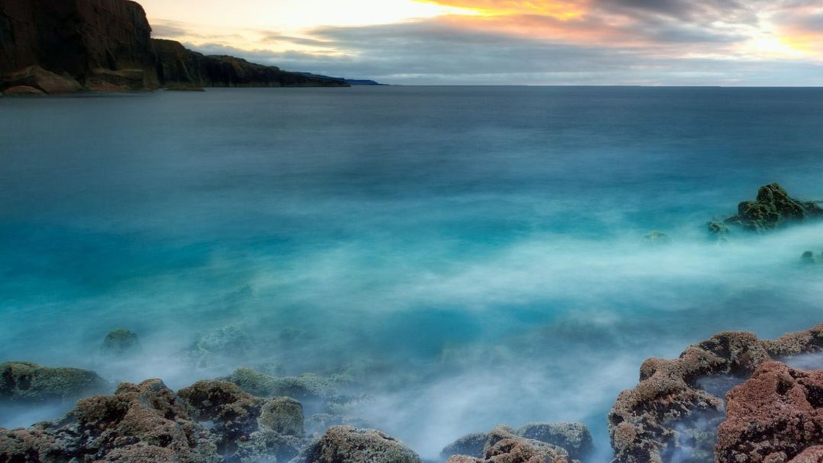 Dramatic rocky coastline at sunset in Fanore, County Clare, Ireland, on the Wild Atlantic Way