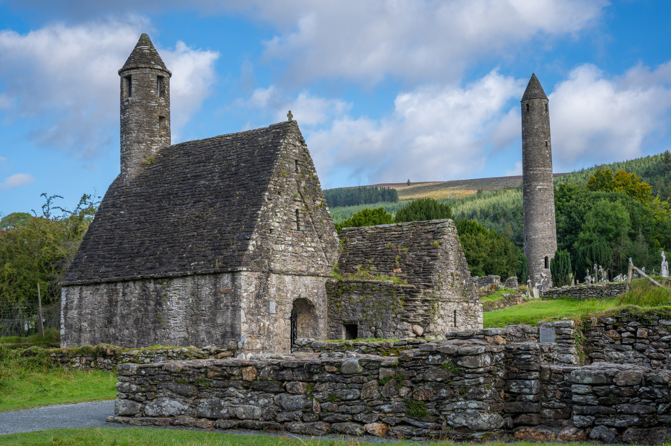 St Kevin's Kitchen stone oratory with round belfry tower, Glendalough monastic city, County Wicklow