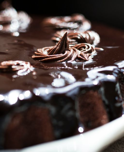 A rich Guinness and Baileys chocolate cake with dark ganache dripping over the sides