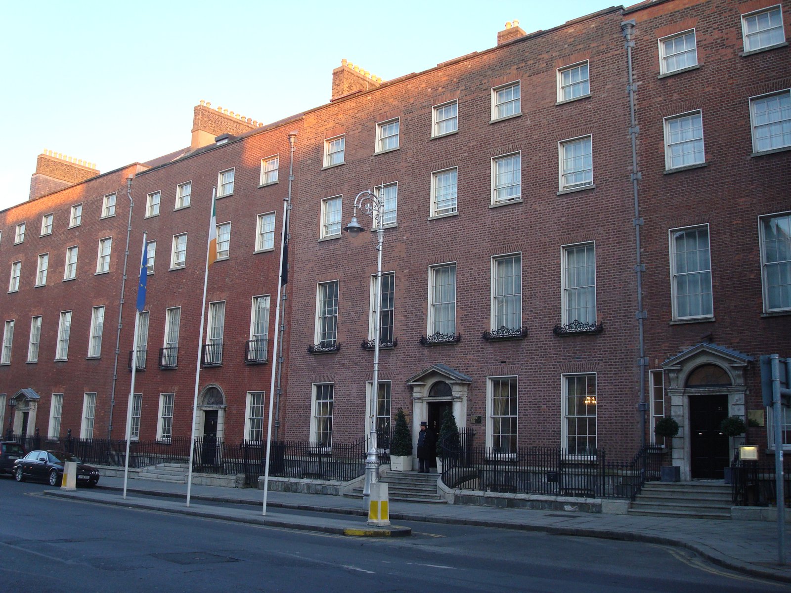 The Merrion Hotel on Upper Merrion Street in Dublin &mdash; Georgian terrace facade with Irish tricolor and EU flags