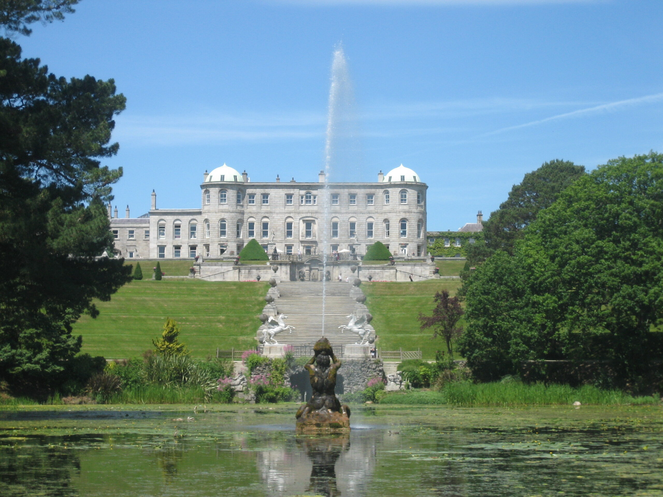 Powerscourt Estate's Italian Garden fountain and Triton Lake with the Wicklow Mountains behind