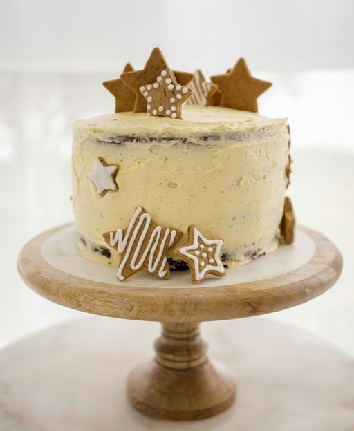 Rustic layer cake covered in smooth ivory Swiss meringue buttercream frosting