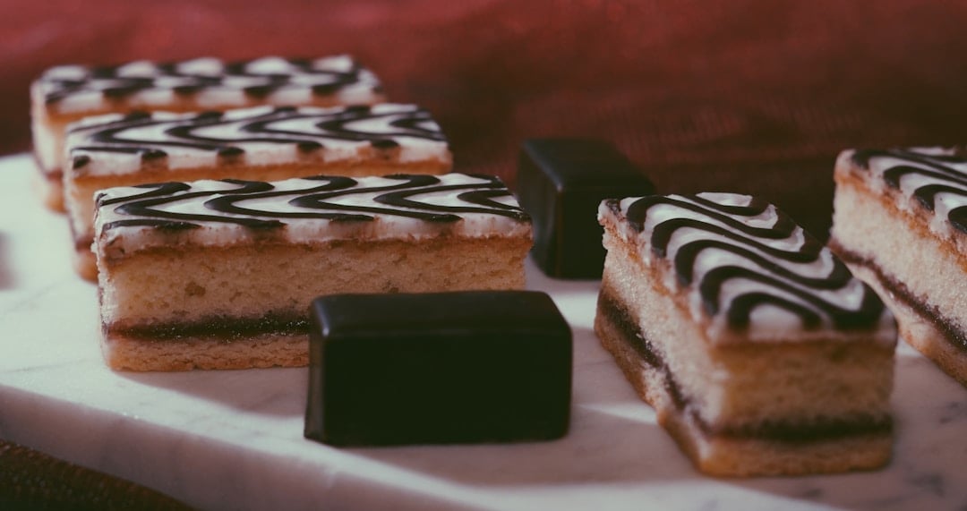 Traditional Irish Tipsy Cake with pink fondant icing and chocolate feathering