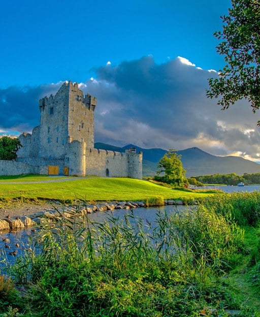 Ross Castle reflected in Lough Leane, Killarney National Park, County Kerry