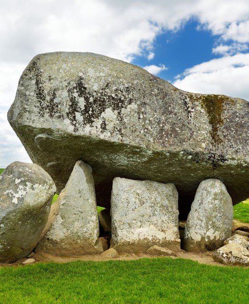 Brownshill Dolmen in County Carlow &mdash; a massive granite capstone resting on upright stones in an open field