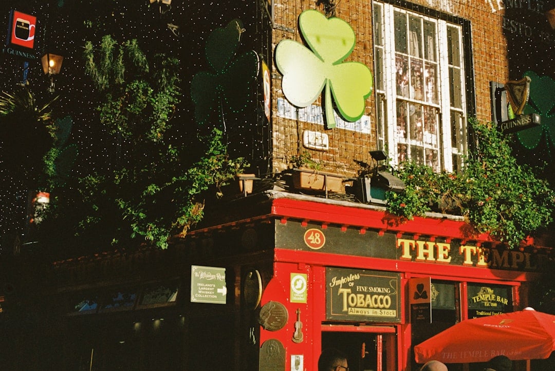 a red building with a four leaf clover on it