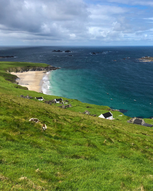 Aerial view of the abandoned stone village and White Strand beach on the Great Blasket Island, County Kerry, Ireland