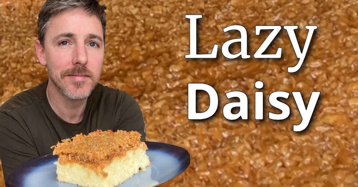 Golden Lazy Daisy Cake (Dr&oslash;mmekage) with caramelised coconut topping, slice showing moist sponge base