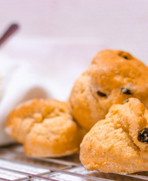 Fresh raisin fruit scones with golden crust and visible dried currants