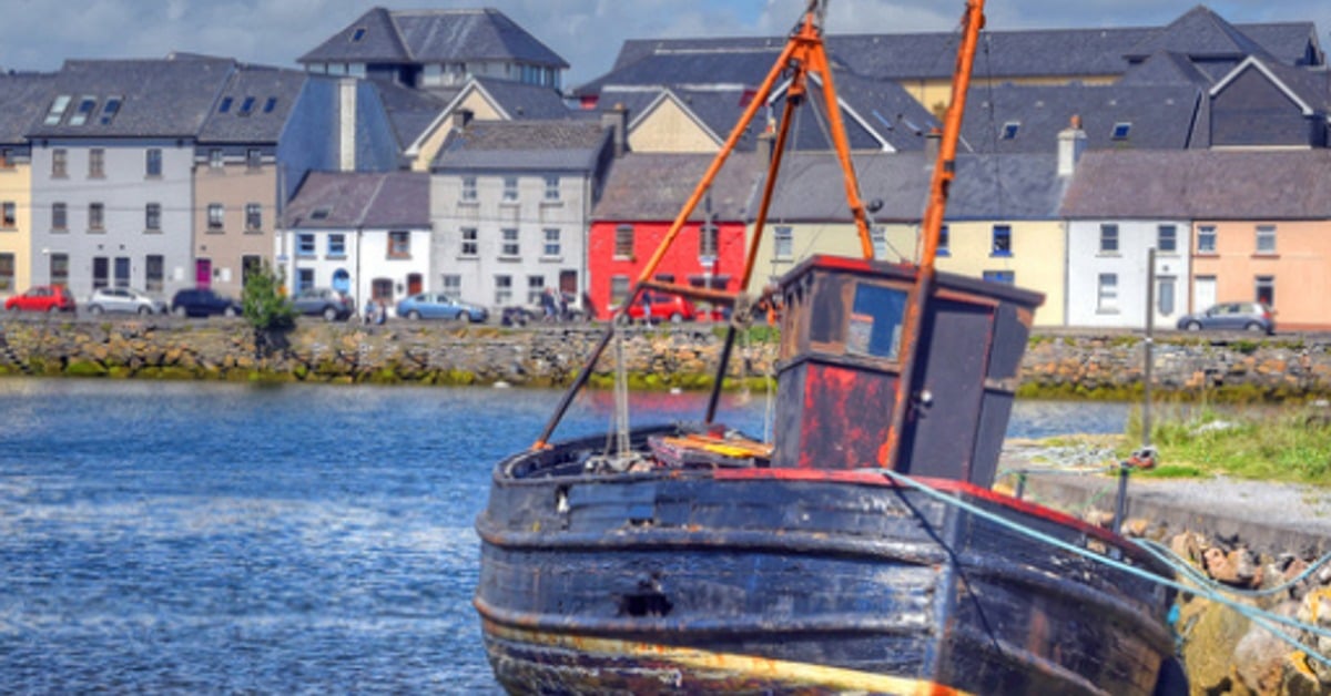The Claddagh fishing village, Galway, Ireland &mdash; colourful boats and traditional houses along the waterfront