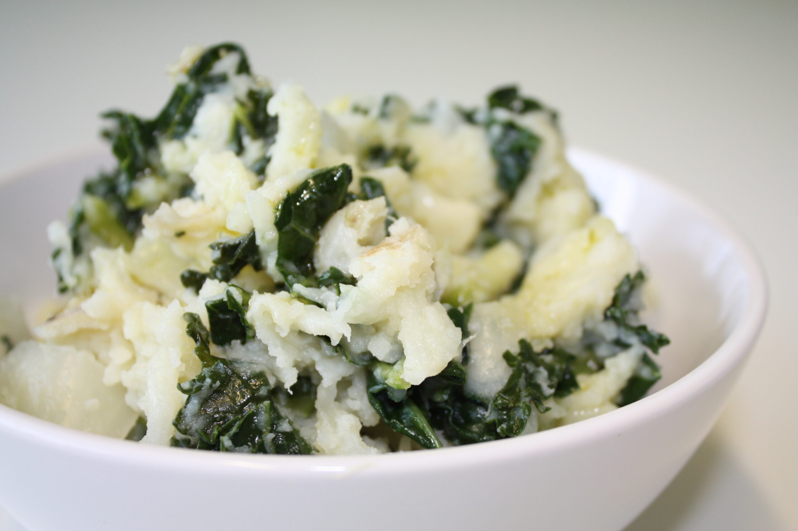 A bowl of Irish colcannon &mdash; creamy mashed potato folded with kale, a traditional Irish dish