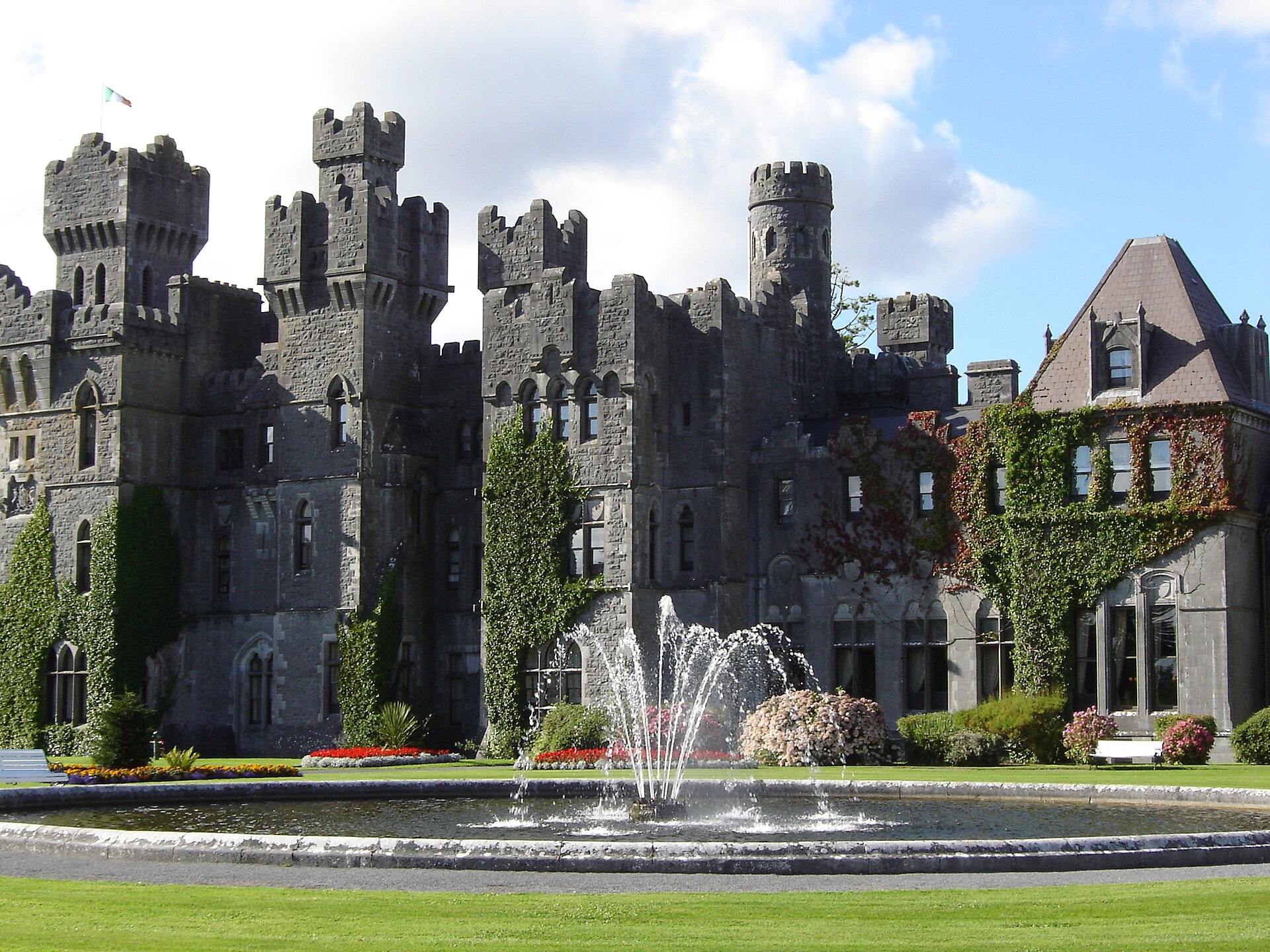 Ashford Castle in County Mayo, a 13th-century castle turned five-star hotel, seen across its garden fountain and lawns