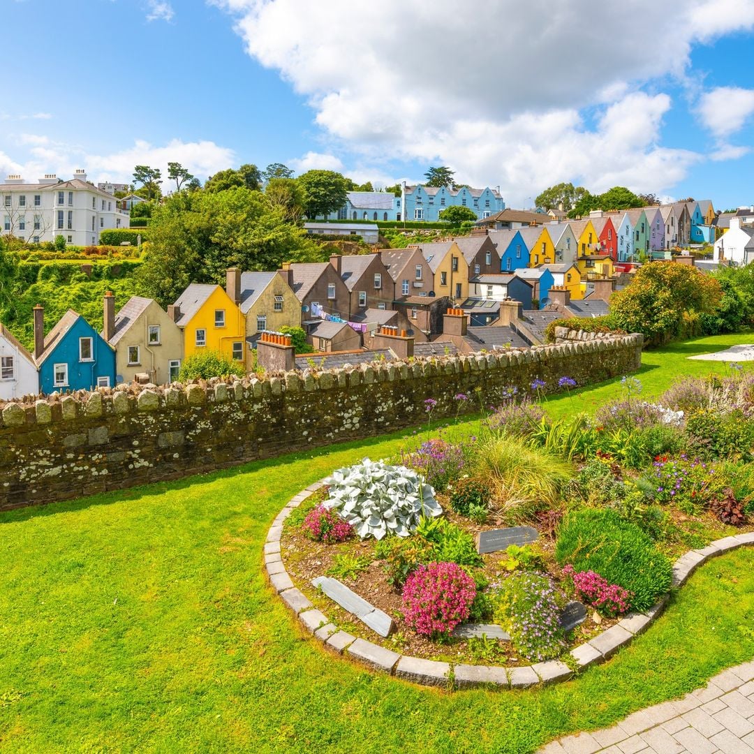 The colourful Deck of Cards houses in Cobh, County Cork, stacked in a cascade of reds, yellows, greens and blues on a steep hillside above Cork Harbour