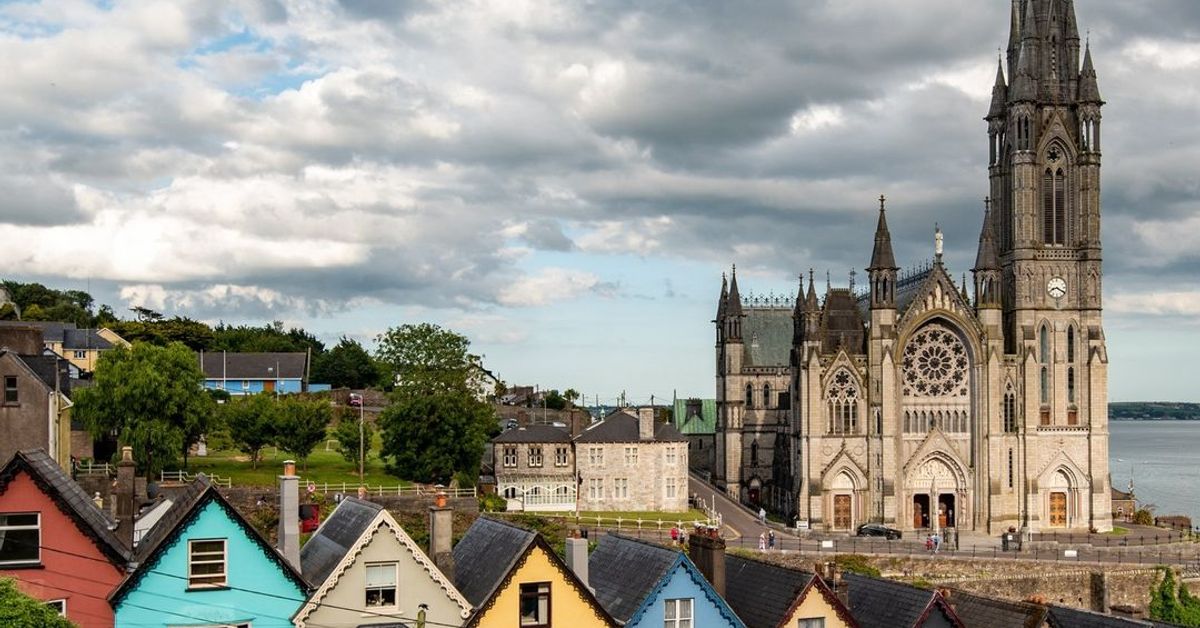 Colourful terraced houses in Cobh, County Cork, Ireland, with St Colmans Cathedral in the background