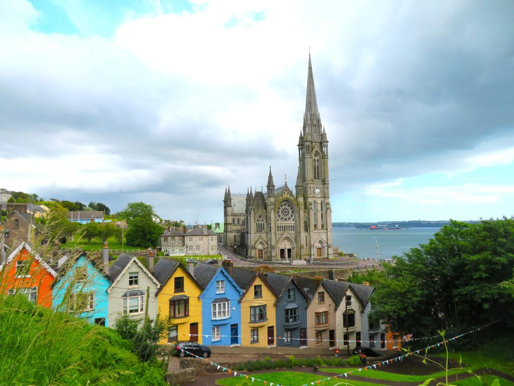 Colourful terraced houses on the hill below St. Colman’s Cathedral, overlooking Cork Harbour, Cobh