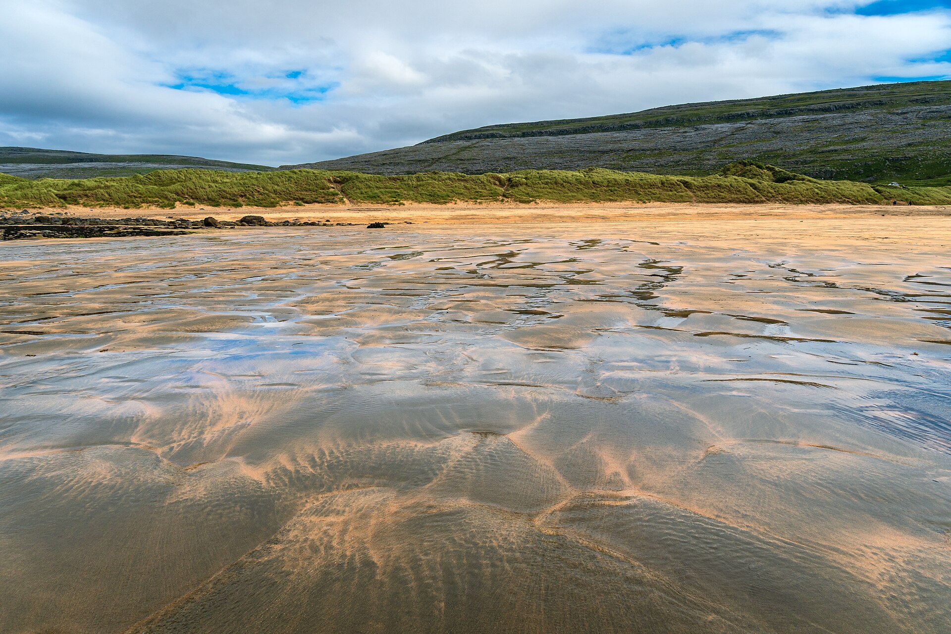 Fanore Beach at low tide, County Clare, Ireland, with sandy shore, Atlantic Ocean and Burren hills beyond