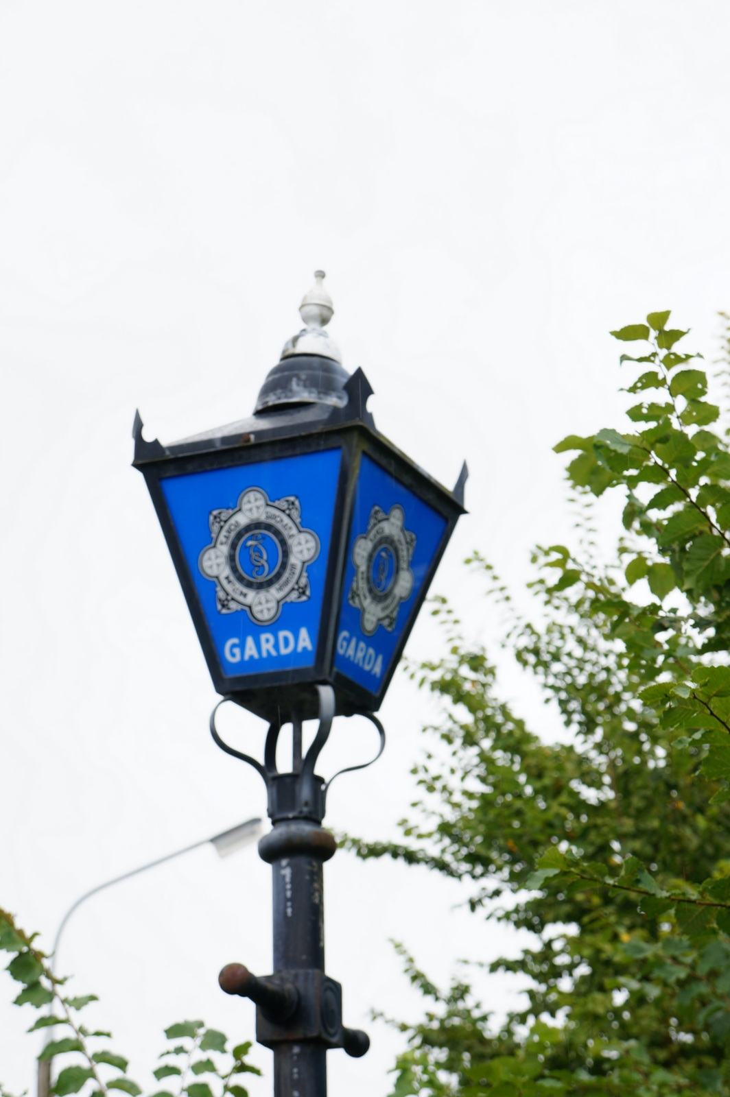 Garda lamp with the An Garda S&iacute;och&aacute;na crest outside a Garda station in Sneem, County Kerry, Ireland