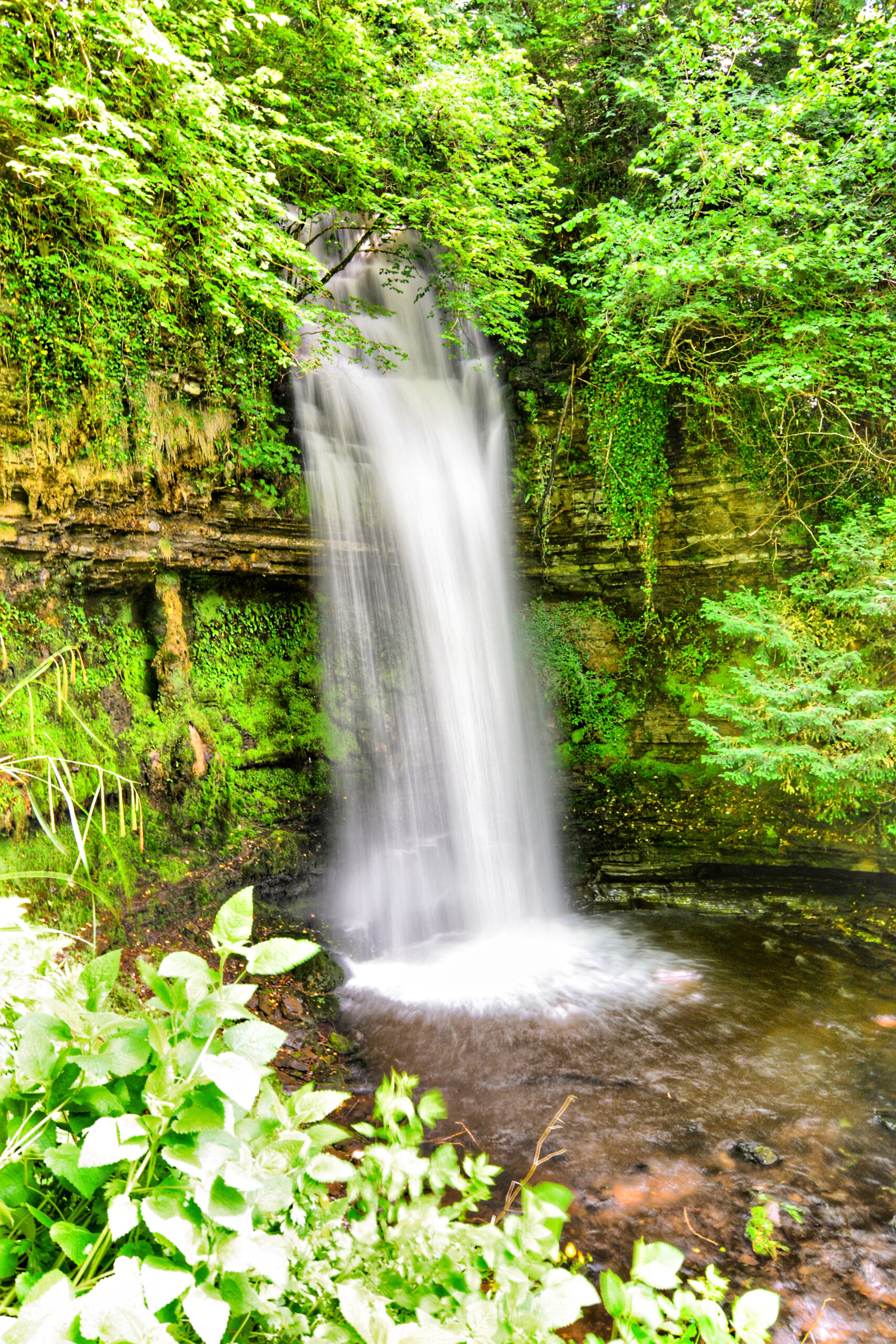 Glencar Waterfall cascading down a rocky hillside near Sligo, Ireland