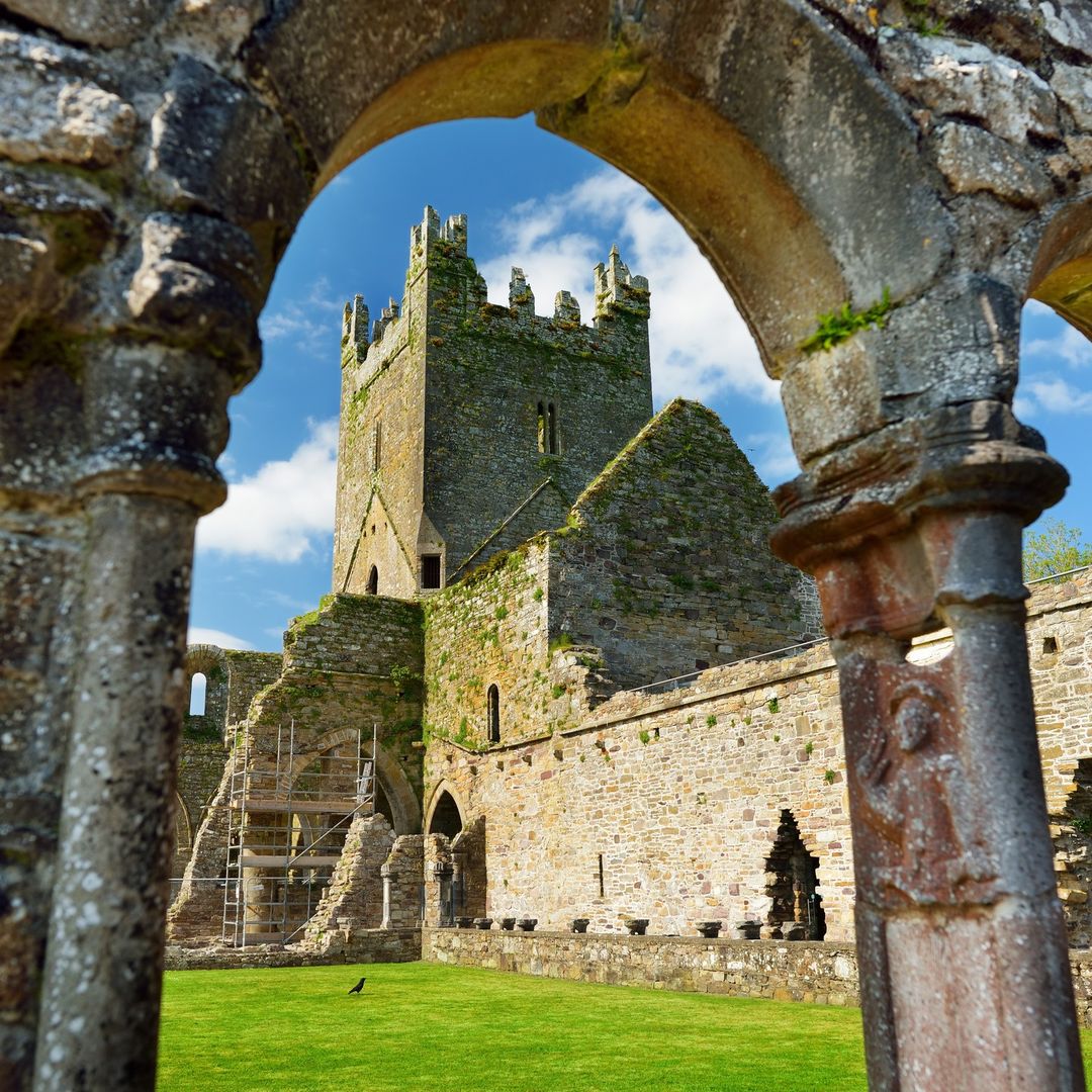 Jerpoint Abbey tower framed through a Romanesque arch, County Kilkenny, Ireland