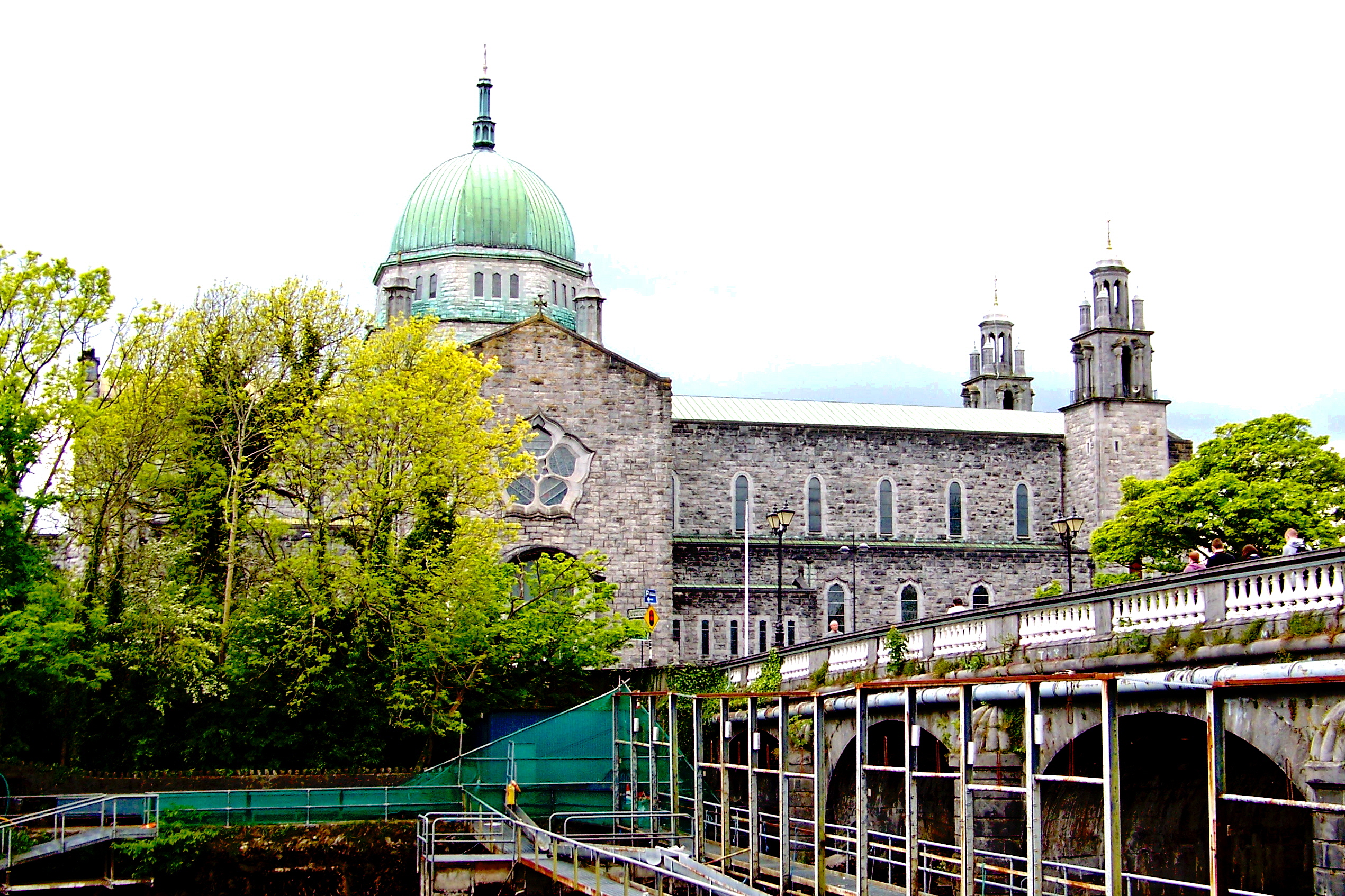 Galway Cathedral and the River Corrib seen from the Salmon Weir Bridge walk