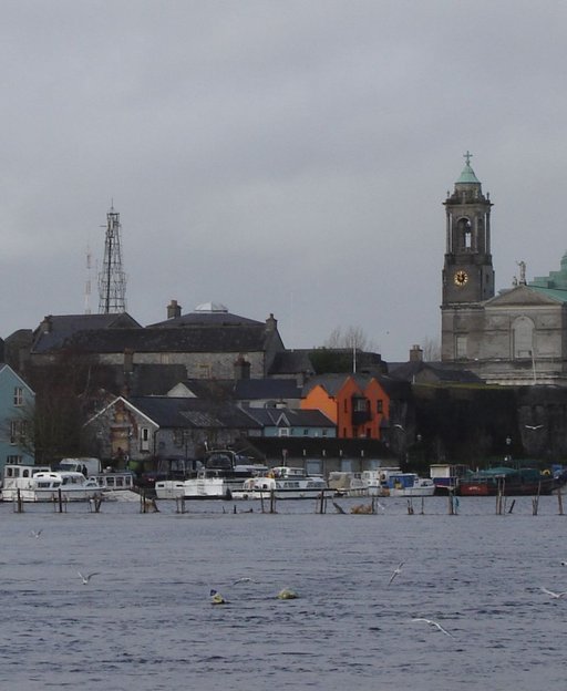 View across the River Shannon of Athlone town and its twin-domed church, County Westmeath, Ireland