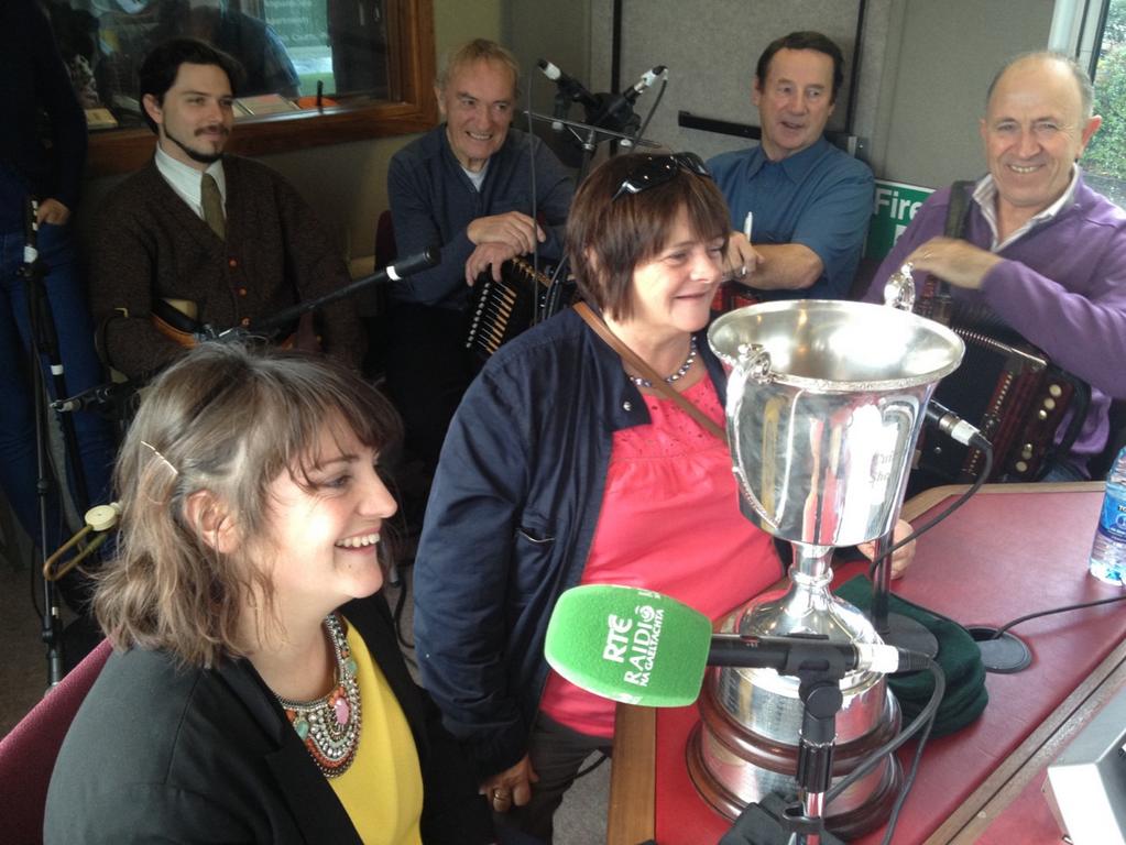 A sean-n&oacute;s singer celebrating her Corn U&iacute; Riada competition win at Oireachtas na Gaeilge, Ireland's premier unaccompanied singing contest