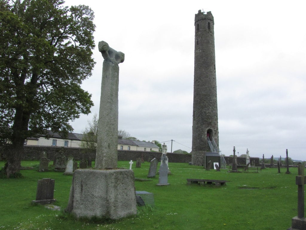 The round tower and an ancient high cross beside St. Brigid's Cathedral in Kildare town