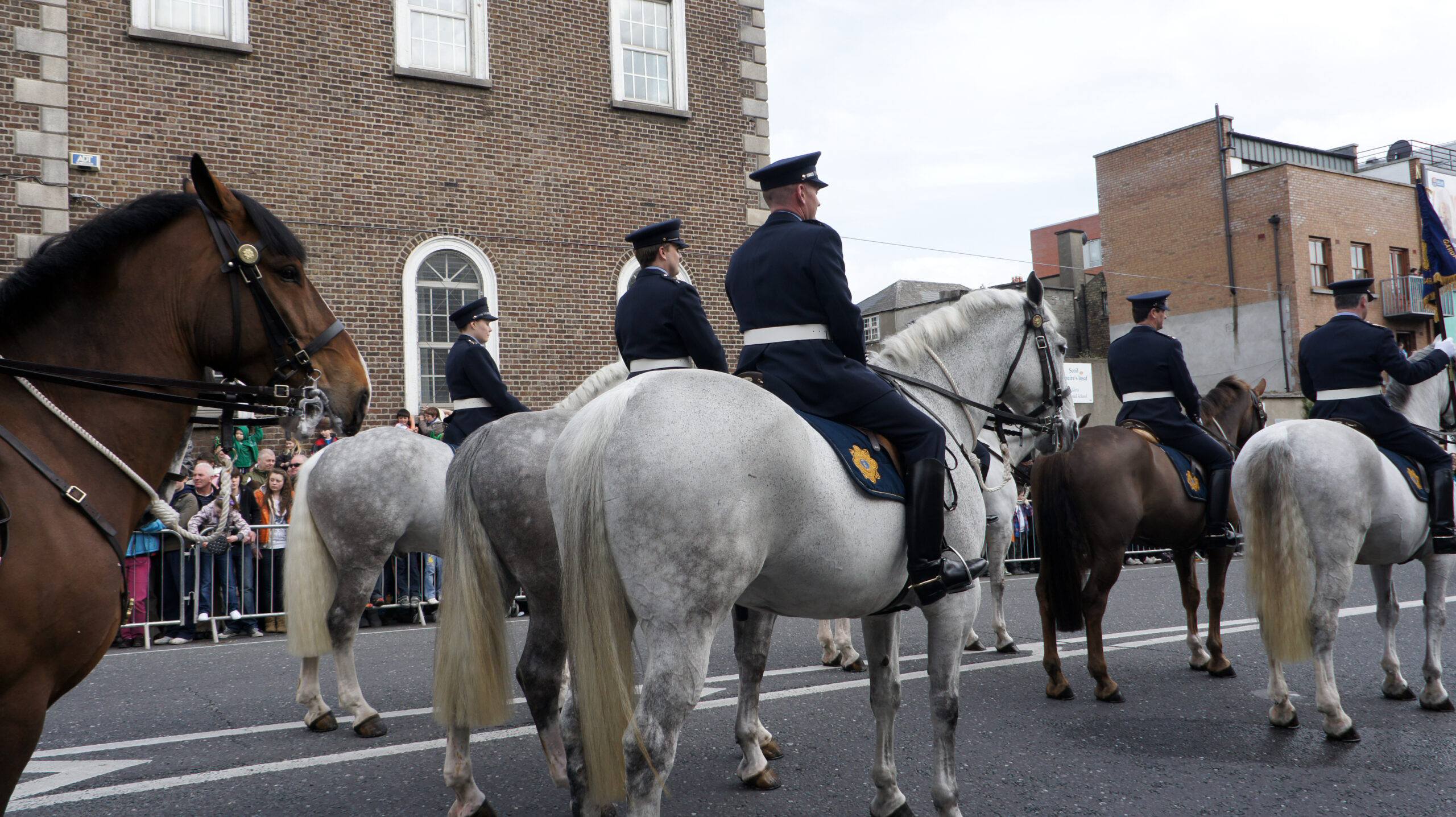 Mounted Garda officers lead the St Patrick's Day Parade through Dublin city centre as crowds line the street