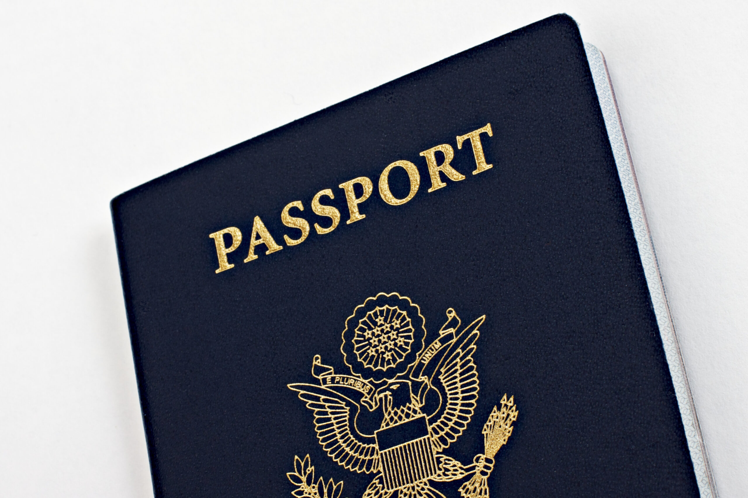 Close-up of a United States passport cover with gold eagle emblem